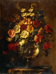 Flores em um vaso de vidro em uma rocha,
