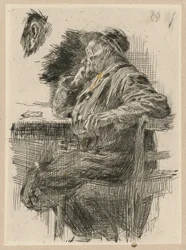 Homem sentado à mesa