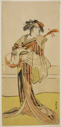 O ator Yamashita Mangiku I como Osan na peça Kitekaeru Nishiki no Wakayaka, representada no Teatro Nakamura no décimo primeiro mês de 1780