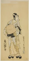O ator Ichikawa Danjuro V como Soga no Goro disfarçado de Komuso na peça Sakai-cho Soga Nendaiki, apresentada no Teatro Nakamura no primeiro mês de 1771