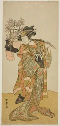 O ator Yamashita Kinsaku II como Odai, um vendedor de Eboshi (chapéu), na peça Hana-zumo Genji Hiiki, apresentada no Teatro Nakamura no décimo primeiro mês, 1775