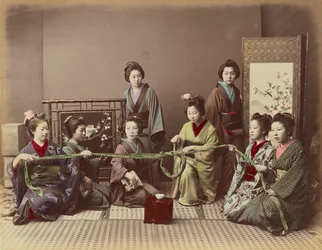 (Konkonchiki) Rapariga japonesa a jogar, c. 1880