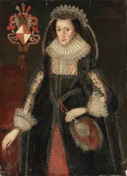Retrato de Lady Eleanor Dutton, de três quartos, em um vestido elegante, de pé ao lado de uma cadeira inscrita com brasões da família Dutton de Cheshire e Gloucestershire