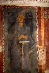 Representação de São François de Assis (1181-1226) Esta é certamente a primeira representação do santo executada em vida, representando sem estigma e sem auréola. Ele tem um papel ou está escrito em latim "Pax huic Domui" (Paz