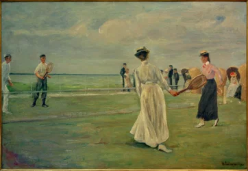 Jogadores de ténis junto ao mar