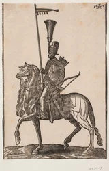 Soldado montado, perfil a v.; lança com galhardete, arco ao lado, escudo circular, aljava; cocar com arbusto de penas