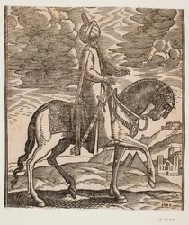 Cavaleiro de turbante, espada à direita, perfil para a direita; entre as patas dianteiras do cavalo, duas pirâmides aparecem