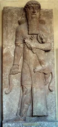 Mesopotâmia: estátua de Sargão dominando um leão, dita Gilgamesh, corte de Khorsabad, século VIII. Paris, Museu do Louvre