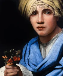Rapaz com turbante a segurar um ramo de flores