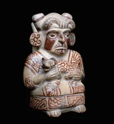 Arte pré-colombiana, civilização mochique (feia, mochica): um chefe mochica com um felino nos braços. Vaso de barro antropomórfico. 200 AC-700 DC. Lima, Museu Nacional de Antropologia e Arqueologia, Peru.