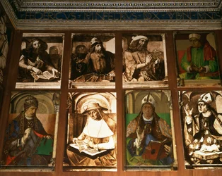 O estudo de Federigo da Montefeltro, Duque de Urbino, no sentido horário de TL: os filósofos gregos Platão (c.427-347 aC) e Aristóteles (384-322 aC); Ptolomeu, astrônomo (c. 90-168); Boécio, filósofo (c.48