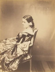 Retrato de uma mulher sentada de perfil