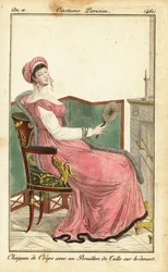 Mulher sentada em uma cadeira Empire em um salão, Paris