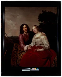 Um retrato de casamento de um jovem casal num cenário de paisagem