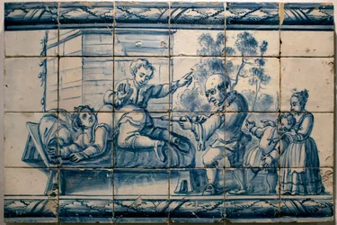 O médico a administrar um clister a um paciente - Painel satírico de Lisboa, primeira metade do século XVIII (Médico - Painel satírico, primeira metade do século XVIII) - Museu Nacional do Azulejo, Lisboa (Portugal)