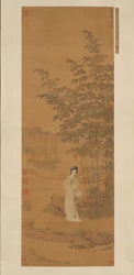 Senhora em um bosque de bambu.