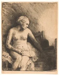 Mulher no banho, com um chapéu ao lado dela