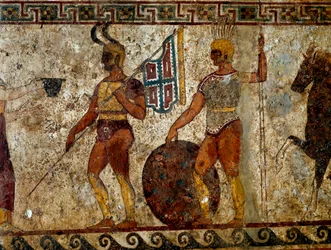 Guerreiros samnitas. Pintura tumular do século IV a.C., proveniente do sítio de Paestum, Itália. Dimensões: 112x199 cm. Inv. 9363. Museo nazionale archeologico, Nápoles (Museu Arqueológico de Nápoles).