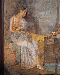 Fresco representando uma mãe a amamentar o seu bebé, de Pompeia, Itália