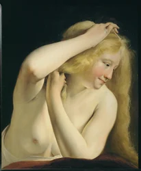 Mulher jovem a pentear-se ...