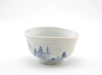 Tigela de chá com desenho paisagístico, início do século XVII (porcelana com pigmento de cobalto sob vidrado translúcido)