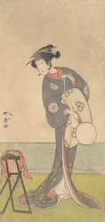 O primeiro Nakamura Tomijuro como um Oiran de pé em uma sala, 1771.