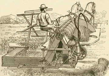 Uma máquina de colheita, puxada por cavalos, que amarrava mecanicamente os feixes de milho, utilizada no final do século XIX. De El Museo Popular publicado Madrid