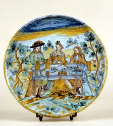 Representação de um banquete ao ar livre numa placa cerâmica de Talavera de la rejna (Espanha). Início do século XVI. Milão, Museo del Castello.