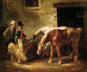 Dois cavalos de post na porta de um estábulo