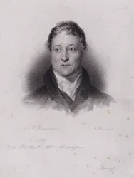 William Huskisson, político e financeiro inglês, morto em um acidente ferroviário quando foi atropelado pela pioneira locomotiva a vapor Rocket (gravura) de Robert Stephenson