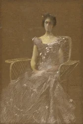 Dama numa poltrona de vime