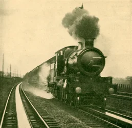 Um motor da classe Star que recolhe água na velocidade, Goring, Great Western Railway, 1930.