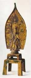 Figura de bronze dourado de Kuan-Yin, 334 dC, 1936