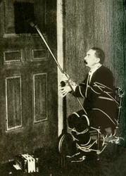 John Nevil Maskelyne realiza uma ilusão de gabinete espiritual, c1910.