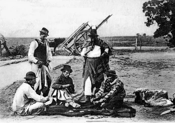 Três homens jogando cartas, Uruguai, c1900s