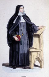 Uma Clarisse, uma religiosa da Ordem de Santa Clarisse fundada no século XIII.
