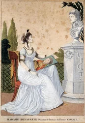 Madame Bonaparte desenha o retrato do Primeiro Cônsul Josephine de Beauharnais (1763-1814) em frente ao busto do seu marido Napoleão Bonaparte (1769-1821). Impressão anônima. 1799-1804. Sol 0,24x0,17 m Malmaison, musee du chateau.