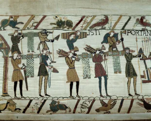 Armas e vinho são trazidos para os navios durante o reabastecimento para a conquete da Inglaterra pelas frotas de Guilherme o Conquistador (1027-1087) em 1066 Detalhe da tapeçaria de Bayeux ou Bordados da Rainha Mathilde