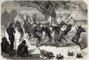 Dança de boas-vindas pelas mulheres da tribo, no regresso de Baker e sua esposa do Lago Albert (Albert Nyanza). Engravure pour illustration le voyage au lac Albert, en 1861-1864, de Sir Samuel White Baker, in "Le tour du monde, nouveau journal des voyages
