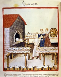 Pão preto: um padeiro a trabalhar diante de um forno. Iluminura do livro de medicina e dietética «Tacuinum sanitatis».
