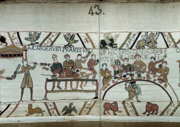 Debarques na Inglaterra, as armas de Guilherme o Conquistador (1027-1087) fazem um banquete enquanto esperam para combater as armas saxônicas de Haroldo II. Guillaume é cercado por Barões e pelo Pormenor Eveque Odon da Tapeçaria Bayeux ou Bordado da Rainha