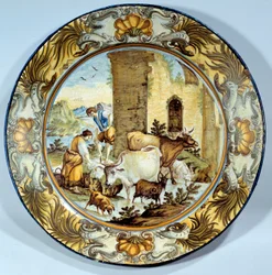 Prato de faiança representando uma cena pastoral. Paris do século XVIII. Musee du Louvre