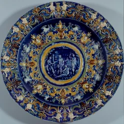 Grande prato de faiança policromada com uma representação do Juízo de Paris. 1550-1600