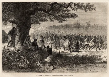 O Vouagogo (tribo da Tanzânia) em preparação para a guerra, debaixo da árvore, o autor da história Henry Morton Stanley (1841-1904). Gravura para ilustrar a viagem em busca de Livingstone, na África central, de Henry Stanley, correspondente do "New-Y