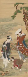 Duas mulheres e uma menina à beira-mar