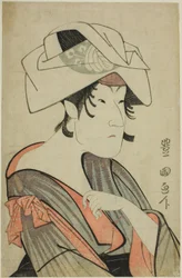 Nakayama Tomisaburo. Vestida como uma mulher com uma toalha na cabeça